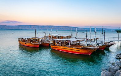 Sunset,View,Of,A,Wooden,Boat,Floating,On,The,Sea